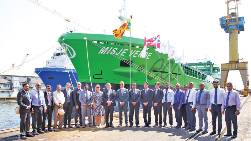 Officials near the vessel 5000DWT eco bulk carrier 'Misje Verde'